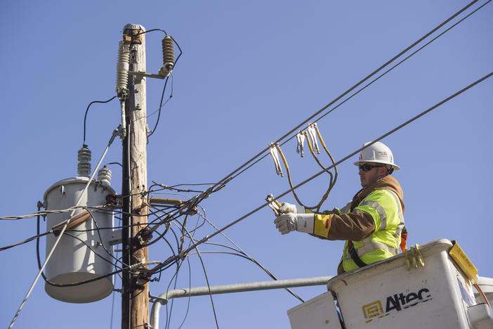 Feb. 13, 2013 Georgia Power crewman goes through the process of restoring power to a neighborhood as he works on a line, in Riverdale, Ga.