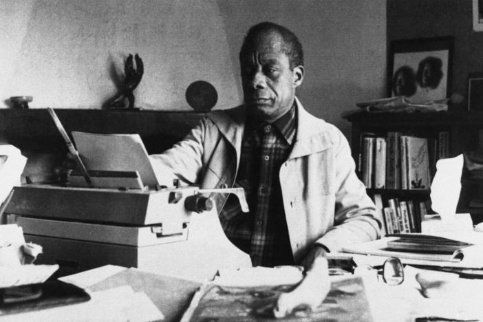 American writer James Baldwin poses in front of his typewriter in his house, March 15, 1983, in Saint Paul de Vence, France.