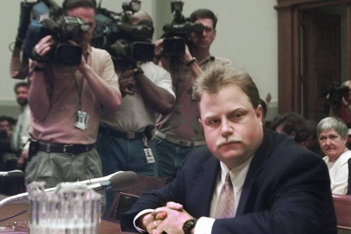 Photographers surround Richard Jewell prior to testifying before a House Judiciary subcommittee hearing on the 1996 Olympic bombing in Atlanta, July 30, 1997.