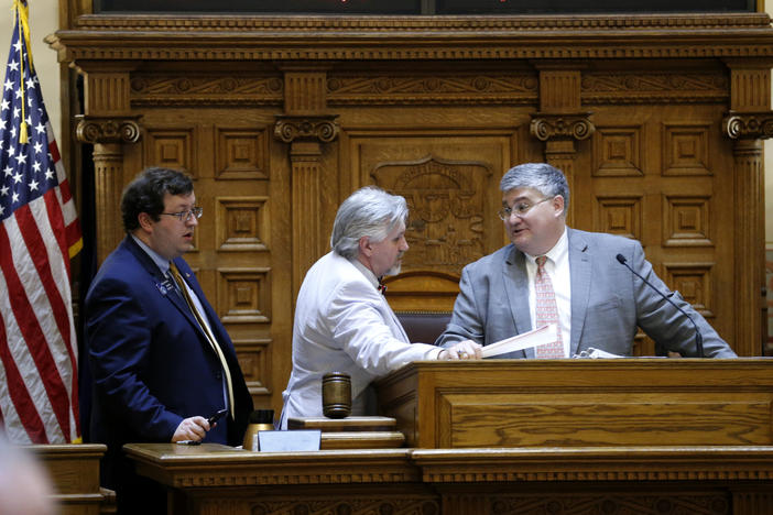 Sen. Josh McKoon, R-Columbus, left, and Sen. Greg Kirk, R-Americus, confer with Senate President Pro Temper David Shafer, R-Duluth, on the Senate floor, March 24, 2016, in Atlanta. 