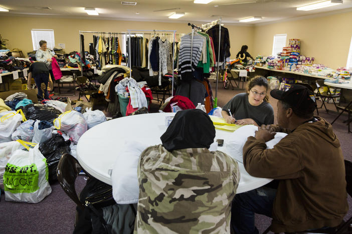 Caption/Description: First Assembly Church of God in Adel was the hub for storm relief activity as people made homeless by the weekend's storm looked for clothes, food and shelter.