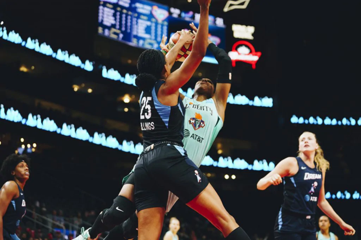 Atlanta Dream forward Monique Billings (25) blocks a shot against the New York Liberty during a game in the 2019 regular season.