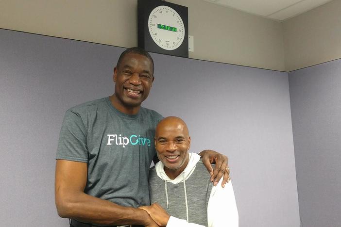 Former Atlanta Hawks player Dikembe Mutombo (l) with guest host Tony Harris (r)