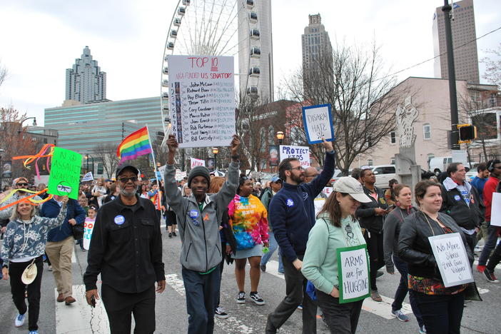 Sixteen-year-old Niles Francis, a student at South Cobb High School, marched with grandfather, Jerry Pennick. Francis is helping lead the effort to get a Georgia law passed requiring school safety drills.