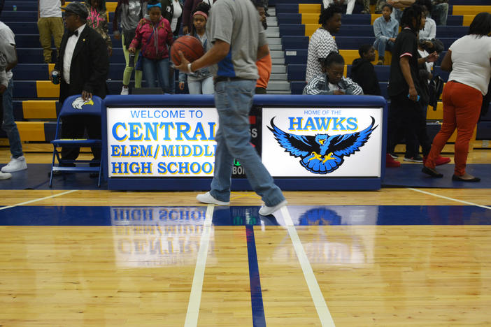 Supporters gather to watch the Central High School Hawks boy's basketball team in the first round of the state playoffs.