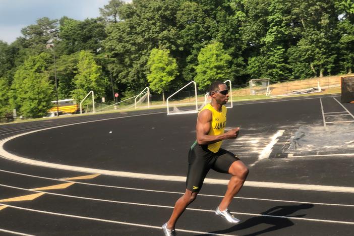 Sprinter Durran Dunn warming up on track field in Smyrna.