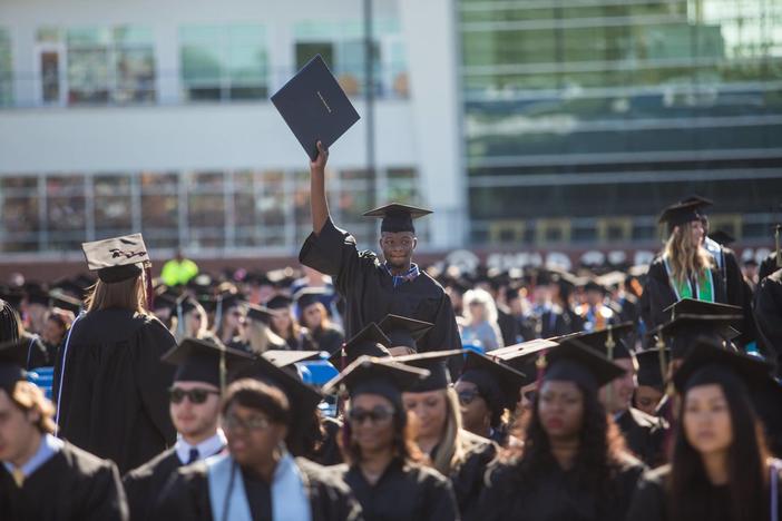 Students at Georgia Southern University attend the 2016 graduation ceremony. The school is merging with Armstrong State University, but will keep its name.