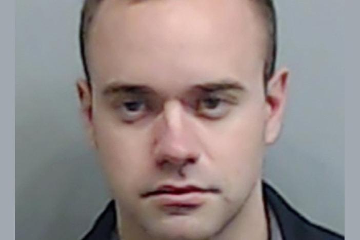 In this booking photo made available Thursday, June 18, 2020 by the Fulton County, Ga., Sheriff's Office, shows Atlanta Police Officer Garrett Rolfe.