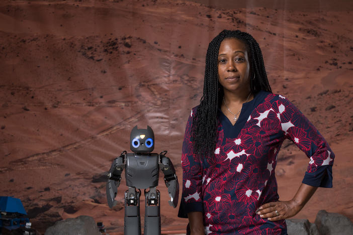 Dr. Howard with Darwin, a robotic assistant that helps children with disabilities accomplish physical therapy at home.