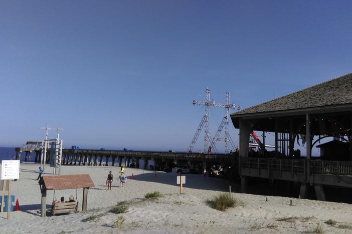 The "Baywatch" filmmakers closed the pier and part of the beach on Tybee Island, and rigged equipment to shoot a motorcycle scene down the pier.