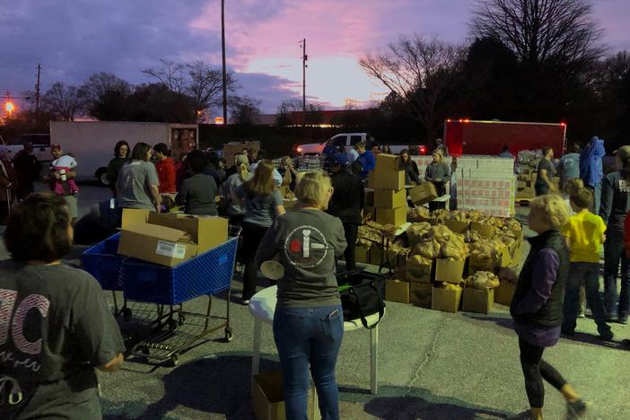 iServe Ministries prepares to give out 30,000 pounds of food through its mobile food pantry to families in need.