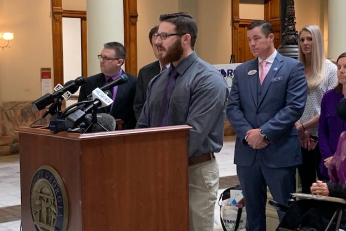 Kyle White speaks at a press conference at the Capitol about how cannabis oil helps him with PTSD.