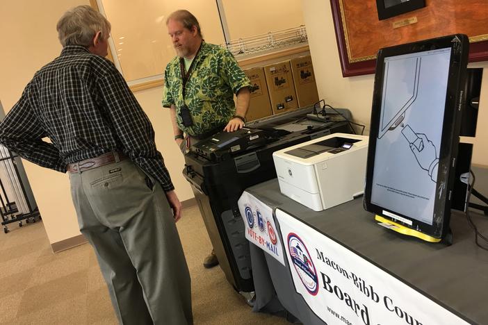 Macon-Bibb County elections officer Thomas Gillon demonstrates the new voting machines Thursday at the board of elections office on Pio Nono Avenue.