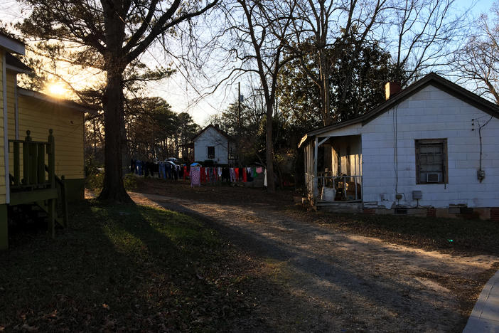 The sun sets on the Rose Hill neighborhood of Porterdale, Georgia. These homes were built in the early 20th century for African-American workers at the nearby cotton mill.