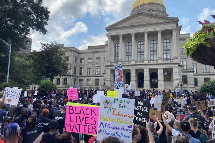 Protesters gather outside of Georgia Capitol following recent cases of police brutality and voting issues.