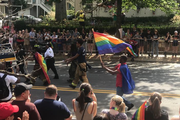 Atlanta police and firefighters march in the Pride Parade. 
