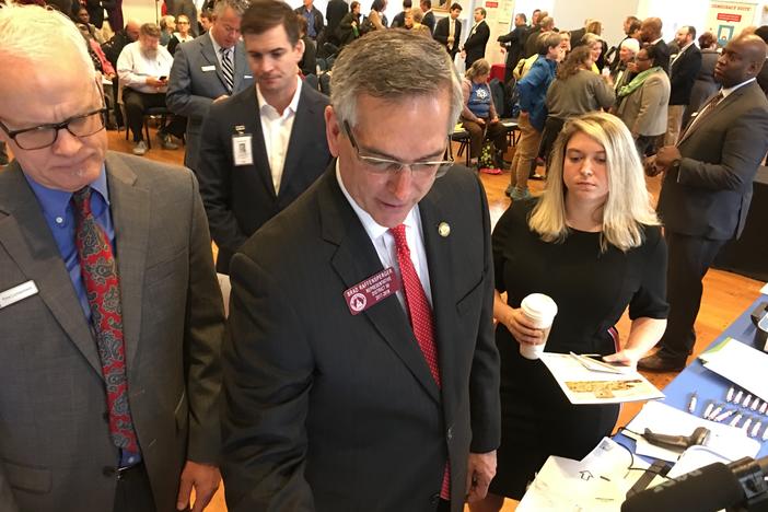 Then-incoming secretary of state Brad Raffensperger demos a voting machine from Hart InterCivic in downtown Atlanta Thursday, Jan. 3, 2019.