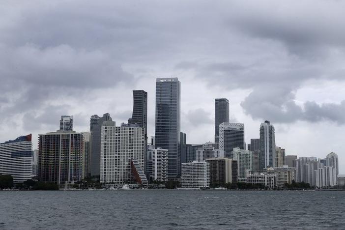 Clouds loom over the Miami skyline Thursday, May 14, 2020. According to the National Hurricane Center website, "A trough of low pressure over the Straits of Florida is producing a large area of cloudiness and thunderstorms."