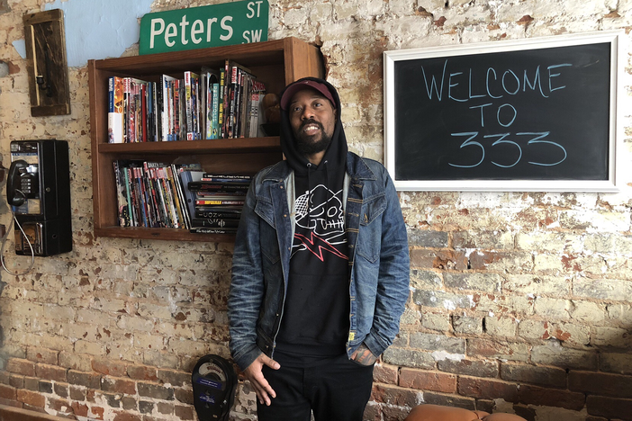 Artist Miya Bailey poses inside Peters Street Station Community Center in Castleberry Hill