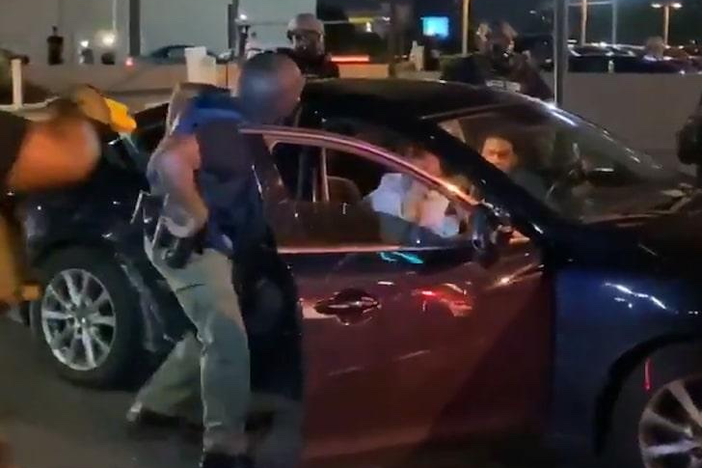 This screenshot photo was taken from an arrest live on TV Saturday May 30, 2020, during the second night of violent protests in Atlanta.