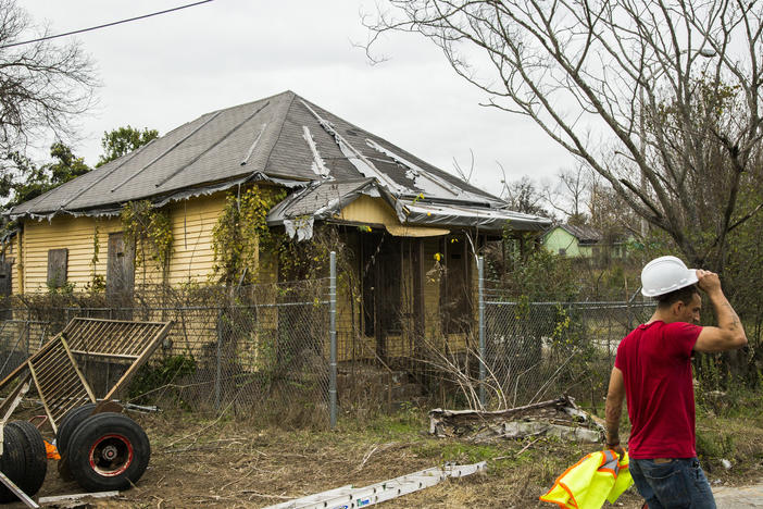 William Simpson ends his work day helping to prepare for moving the home next door to the childhood home of Little Richard, shown here, in Macon's Pleasant Hill Neighborhood Wednesday. 