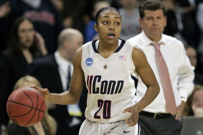 In this March 31, 2009, file photo, Connecticut guard Renee Montgomery brings the ball up during the second half of a women's NCAA college basketball tournament regional final against Arizona State in Trenton, N.J. 