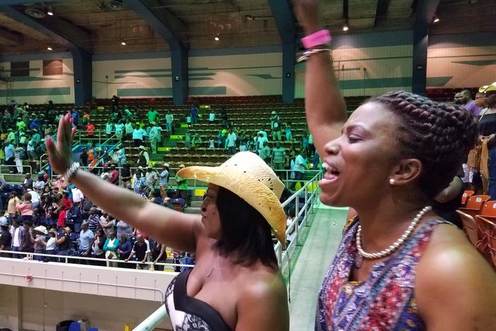 Reeshemah Johnson (left) and Ramona Famble cheer at the Southeastern Rodeo Association's July rodeo in Savannah, Ga., billed as the city's first black rodeo.