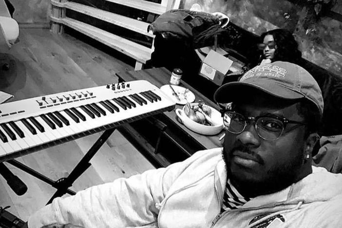 David Harris in studio with musician, H.E.R. 