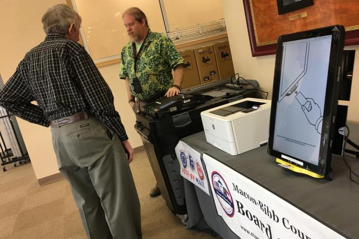 Macon-Bibb County elections officer Thomas Gillon demonstrates the new voting machines at the board of elections office on Pio Nono Avenue.