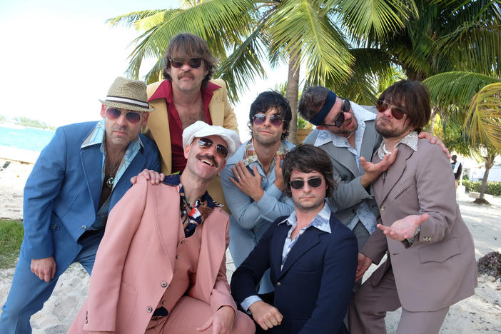 The members of Yacht Rock Revue pose on the beach. Their 9th Annual Yacht Rock Revival is on Aug. 24 at Chastain Park.