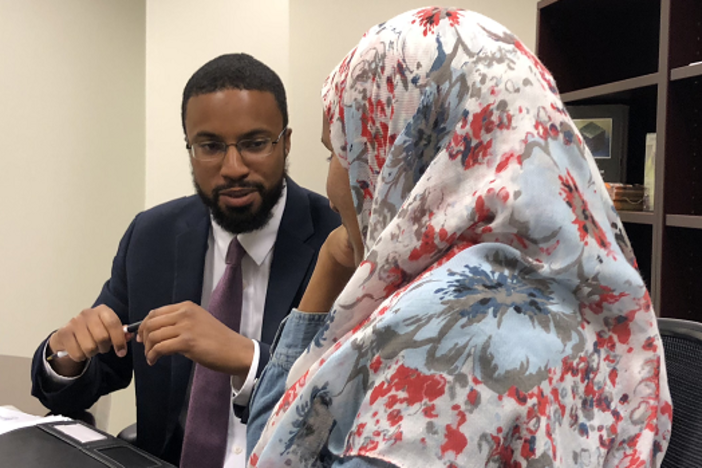 Attorney Edward Ahmed Mitchell (left) discusses on July 24 what Aisha Hussein saw when she and family members watched the April 28 police dashcam footage of her younger sister's shooting.
