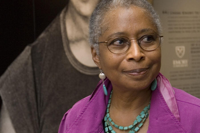  Alice Walker stands in front of a picture of herself from 1974 as she tours her archives at Emory University, in Atlanta.