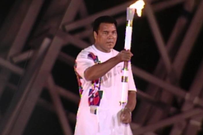 Muhammad Ali holding the Olympic torch during the 1996 games in Atlanta.