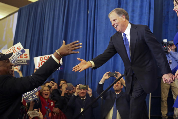 Doug Jones is greeted by a supporter before speaking during an election-night watch party Tuesday, Dec. 12, 2017, in Birmingham, Ala. Jones has defeated Republican Roy Moore, a one-time GOP pariah who was embraced by the Republican Party and the President