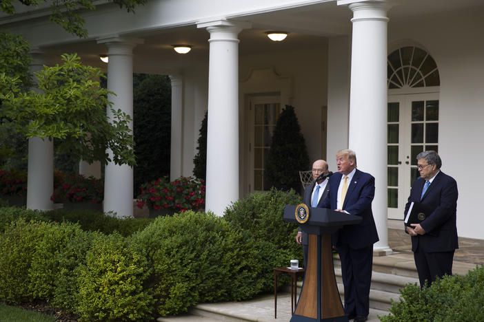 South Dakota has agreed to share driver's license and state ID records with the U.S. Census Bureau as part of efforts to carry out an executive order for citizenship data that President Trump announced in July 2019 with Commerce Secretary Wilbur Ross (left) and U.S. Attorney General William Barr in the White House Rose Garden.