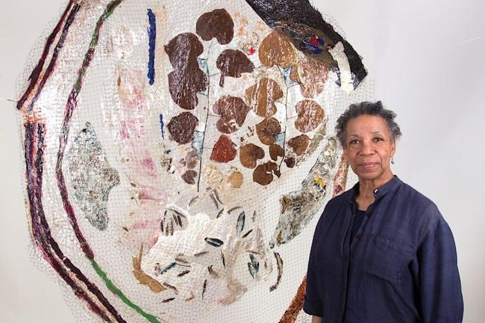 Suzanne Jackson pictured with her "Woodpecker's Last Blues" painting in 2013.