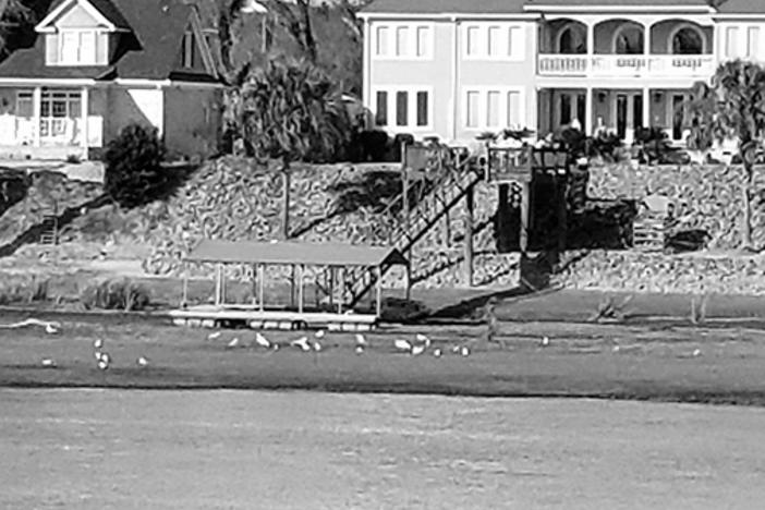 Lower water levels leave boat docks resting on mud flats along Savannah River in Augusta