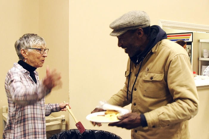 Barb Fischer, left, with a patron of the Sunday brekfast at Centenary United Methodist Church in Macon. 