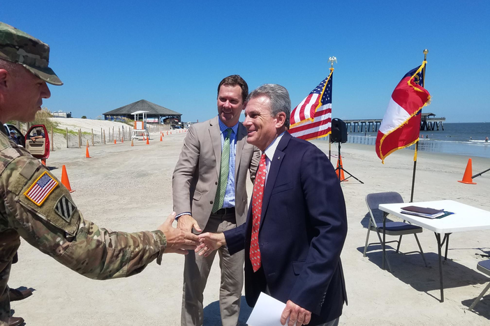 Corps of Engineers Savannah District Commander Col. Daniel Hibner shakes hands with Congressman Buddy Carter (right) and Tybee Mayor Jason Buelterman