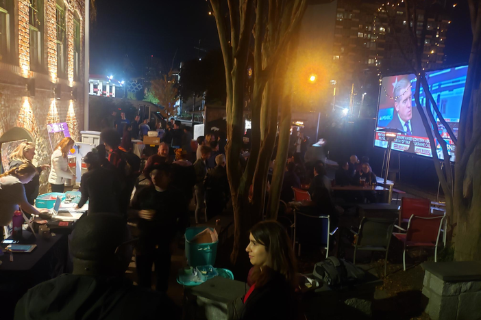 A crowd at Georgia Beer Garden in Atlanta watches the Democratic national debate Nov. 20, 2019.