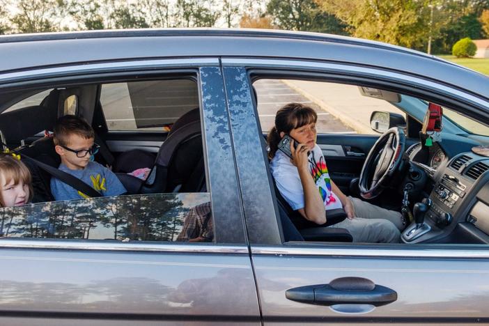 April Smith starts making calls in an effort to find baby formula for her five month old daughter after finding the Health Department in Dougherty County was still closed a week after Hurricane Michael. 