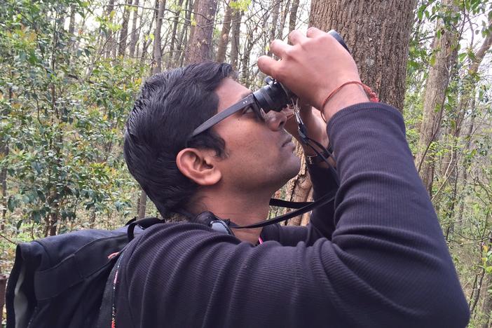 Vinod Babu helps  lead a bird watch near the Fernbank Museum in Atlanta on March 19, 2016.