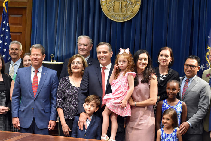 Walt Davis (center, red tie) has been nominated as the state's first statewide business court judge.