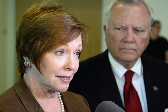In this Oct. 16, 2014 file photo, Brenda Fitzgerald, Georgia Department of Public Health commissioner, left, and Georgia Gov. Nathan Deal respond to questions in Atlanta.