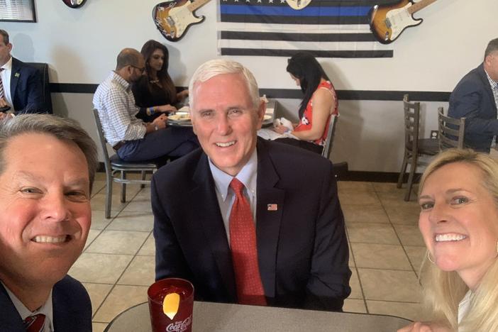 Vice President Mike Pence eats lunch with Georgia Gov. Brian Kemp and his wife Marty Kemp at the Star Cafe, Friday, May 22, 2020, in Atlanta. 