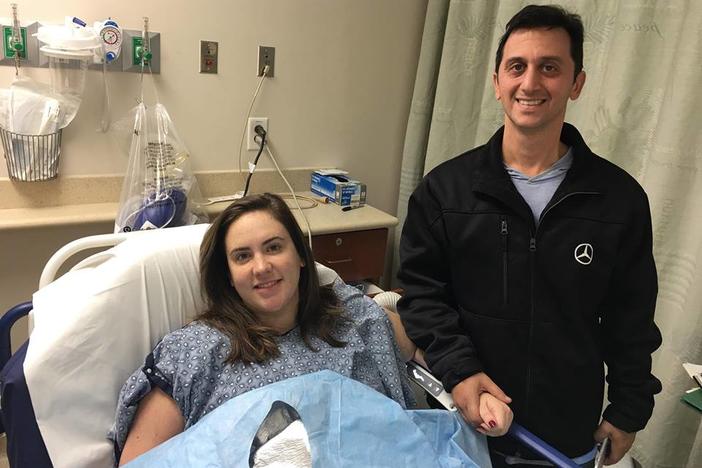 Lauren Caccavone and her husband, Augie, at Northside Hospital after her Nov. 19, 2018, surgery to remove her breast implant.