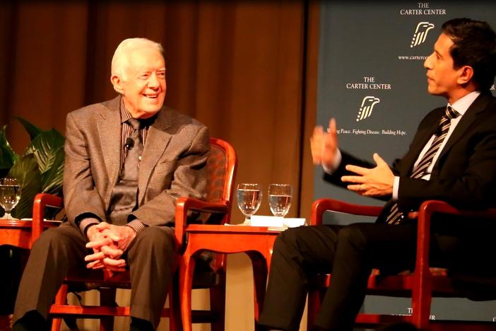 Former U.S. President Jimmy Carter and CNN Chief Medical Correspondent Dr. Sanjay Gupta speaking to an audience at the Carter Center in Atlanta, Wednesday January 11, 2017.