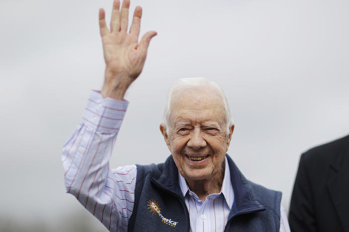 Former President Jimmy Carter waves during a ribbon cutting ceremony for a solar panel project on farmland he owns in their hometown of Plains, Ga., Wednesday, Feb. 8, 2017. 