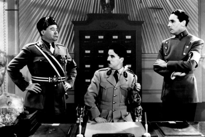 Actor Charlie Chaplin is seen in the film "The Great Dictator," as Adenoidal Hynkel, center, and Jackie Oakie as Napaloni, left, and Henry Daniell as Garbitsch, 1940. 