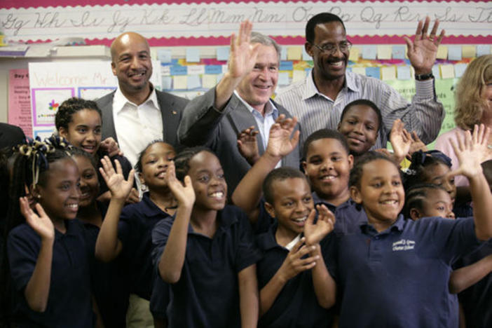 Former President George W. Bush visits charter school students in New Orleans, Louisiana, where the majority of public schools have become charter schools.